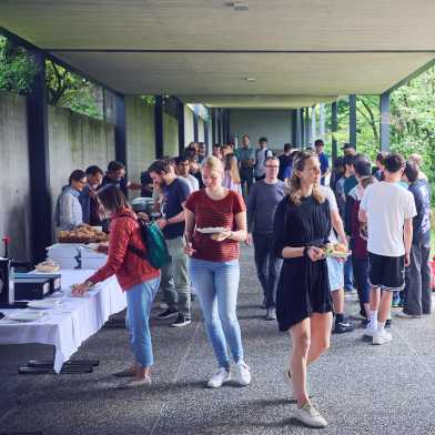 Garden party with people serving and receiving food